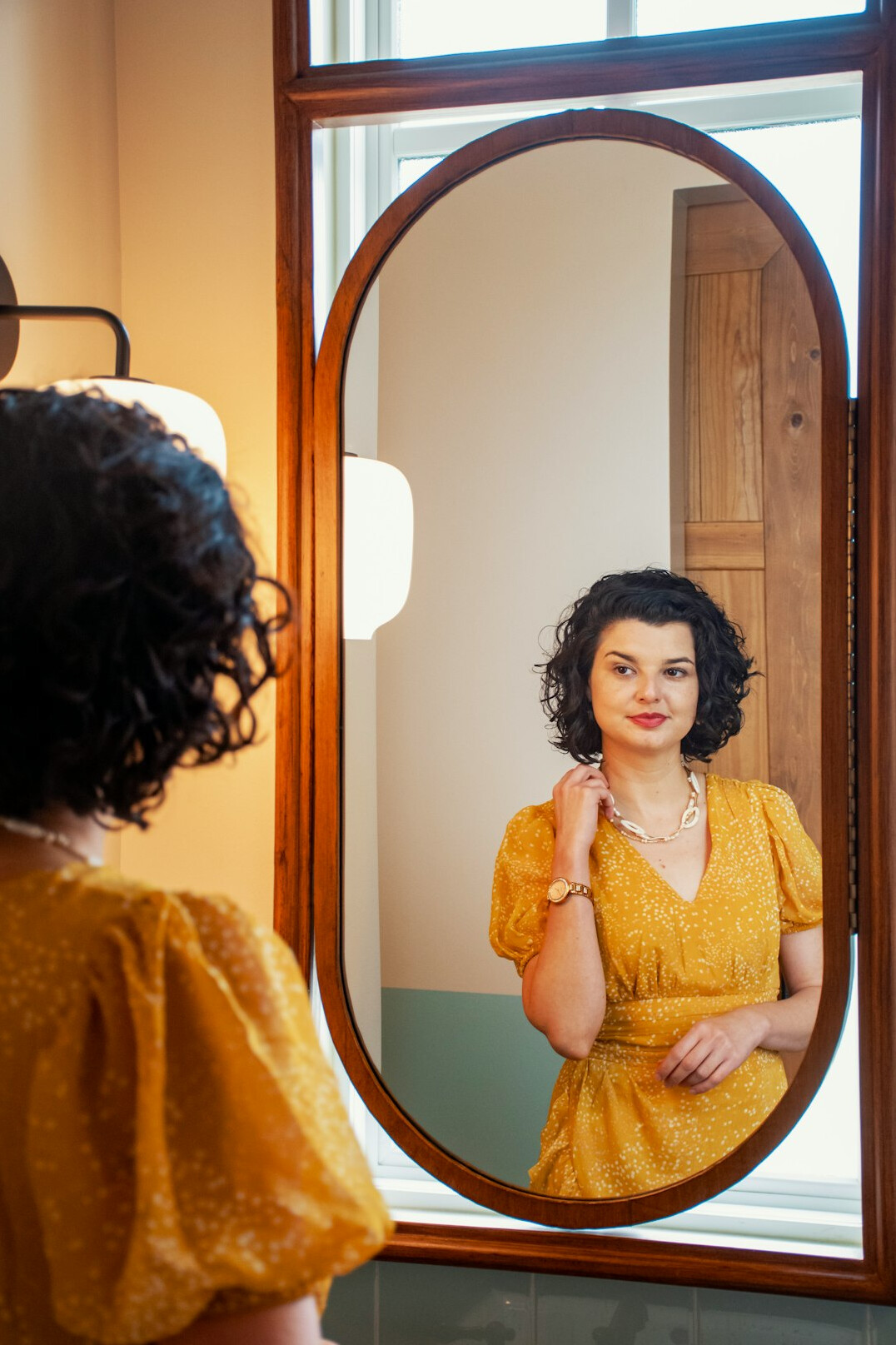 person looking in mirror confidently